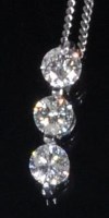 Lot 783 - A 9ct white gold and diamond set pendant, the...