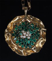 Lot 790 - A modern 18ct gold, emerald and diamond flower...
