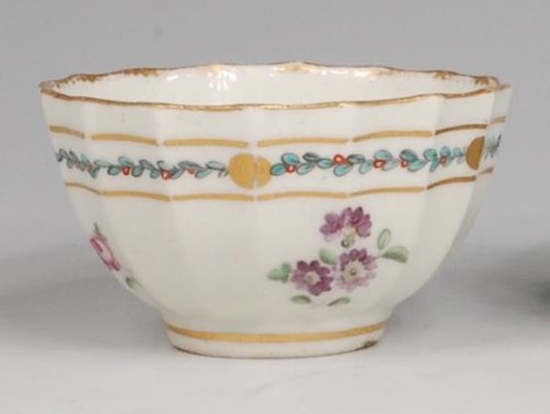 Lot 684 - A first period Worcester fluted tea bowl,...