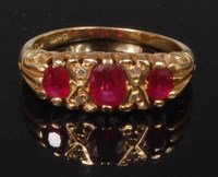 Lot 835 - An 18ct gold, ruby and diamond point set dress...