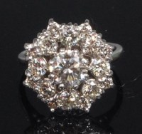 Lot 838 - An 18ct white gold and diamond cluster ring,...