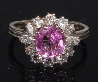 Lot 839 - An 18ct white gold, pink sapphire and diamond...