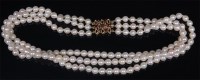 Lot 841 - A cultured pearl triple string and knotted...