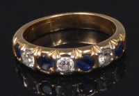 Lot 858 - An 18ct gold, sapphire and diamond half...