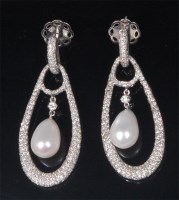 Lot 867 - A pair of 18ct white gold, diamond and pearl...