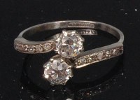 Lot 869 - A platinum ladies diamond crossover ring, the...