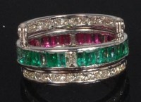 Lot 870 - A contemporary white metal, ruby, emerald and...
