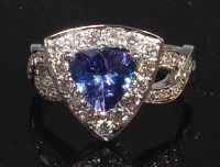 Lot 871 - A contemporary 14ct white gold, tanzanite and...