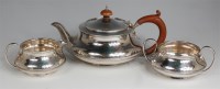 Lot 715 - A George V silver three piece teaset,...
