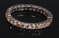 Lot 873 - A 14ct white gold diamond eternity ring,...