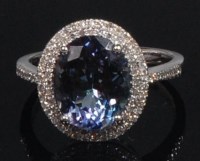 Lot 874 - A contemporary 14ct white gold, tanzanite and...