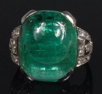 Lot 875 - An Art Deco white metal, emerald and diamond...