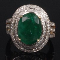 Lot 876 - A contemporary 14ct gold, emerald and diamond...