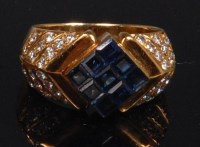 Lot 877 - A modern 18ct gold, sapphire and diamond ring,...