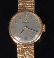 Lot 880 - A ladies Omega 9ct gold cased bracelet watch,...