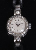 Lot 882 - A ladies Ebel platinum cased diamond set...