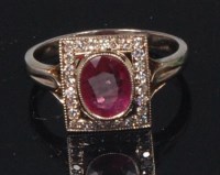 Lot 886 - A white metal, ruby and diamond set dress ring,...