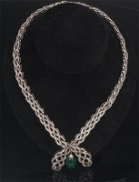 Lot 888 - An impressive white metal, emerald and diamond...