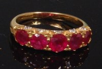 Lot 776 - A yellow metal, ruby and diamond dress ring,...