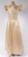 Lot 916 - A late 19th century two-piece cream silk-satin...