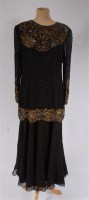 Lot 920 - A 1920s style black chiffon and beaded evening...