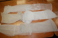 Lot 950 - A collection of Regency and later lace sleeves,...