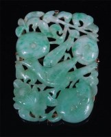 Lot 1010 - A Chinese celadon and green jade brooch, in...