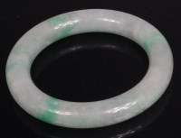 Lot 1011 - A Chinese polished celadon and green jade...