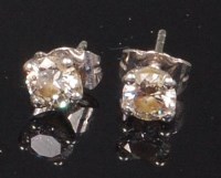 Lot 897 - A pair of 18ct white gold and diamond ear...