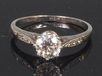 Lot 899 - A platinum and diamond solitaire ring, the...