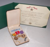 Lot 530 - A Vietnam medal group of three to include...