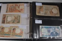 Lot 205 - A folder of approx 50 world and colonial...