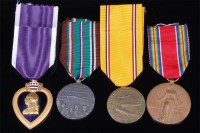 Lot 252 - A group of four medals to include U.S. Purple...