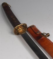 Lot 381 - A WW II Japanese shin gunto katana, having a...