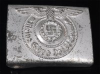 Lot 421 - A German Waffen SS belt buckle marked RZM...