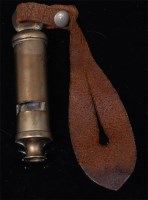 Lot 481 - A WW I trench whistle stamped J. Hudson,...