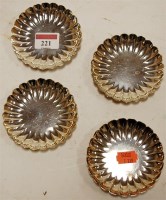 Lot 221 - A set of four sterling silver scallop shaped...
