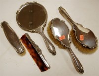 Lot 232 - An early 20th century five piece silver backed...