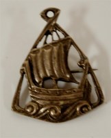Lot 306 - An Arts & Crafts silver brooch in the form of...