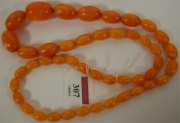Lot 307 - A beaded faux amber necklace