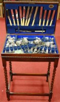 Lot 247 - A 1920s oak barleytwist table canteen of...