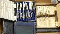 Lot 250 - A box of miscellaneous cased silver plated...