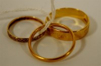 Lot 290 - Two 22ct gold wedding bands, 10.9g; and a 9ct...