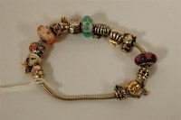 Lot 292 - A Pandora Links ladies bracelet, containing a...