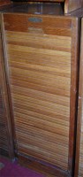 Lot 1091 - A 1930s light oak tambour fronted office...