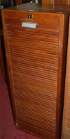 Lot 1093 - A 1930s light oak tambour fronted office...