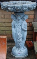 Lot 1118 - A reconstituted shaped pedestal birdbath,...