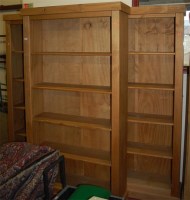 Lot 1125 - A set of three modern pine freestanding open...