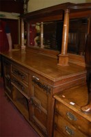 Lot 1434 - An Arts & Crafts oak mirrorback sideboard, the...