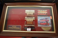 Lot 381 - A framed display of Matchbox models of...